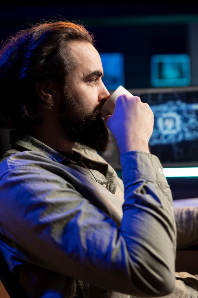 Developer drinking coffee updating artificial intelligence machine learning