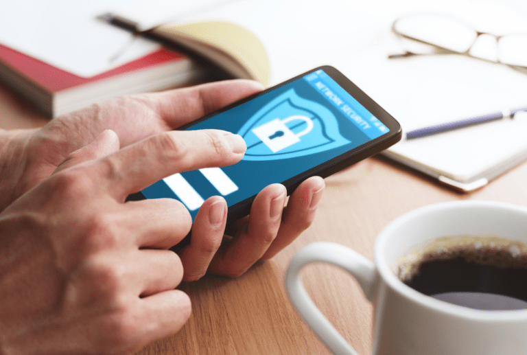 A person uses a smartphone displaying a data security app with a lock icon, ensuring their information is protected.