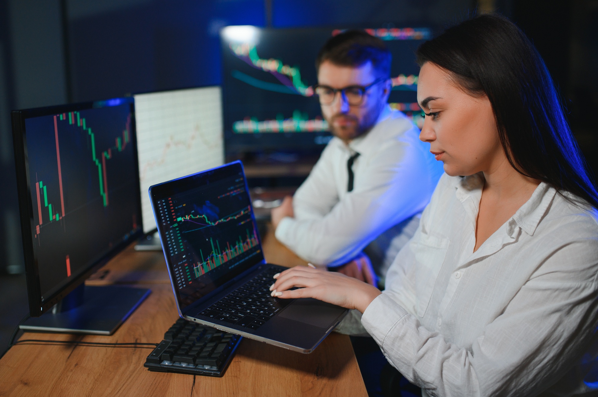 Financial Analyst Talking to Investment Banker in Late Evening at Work