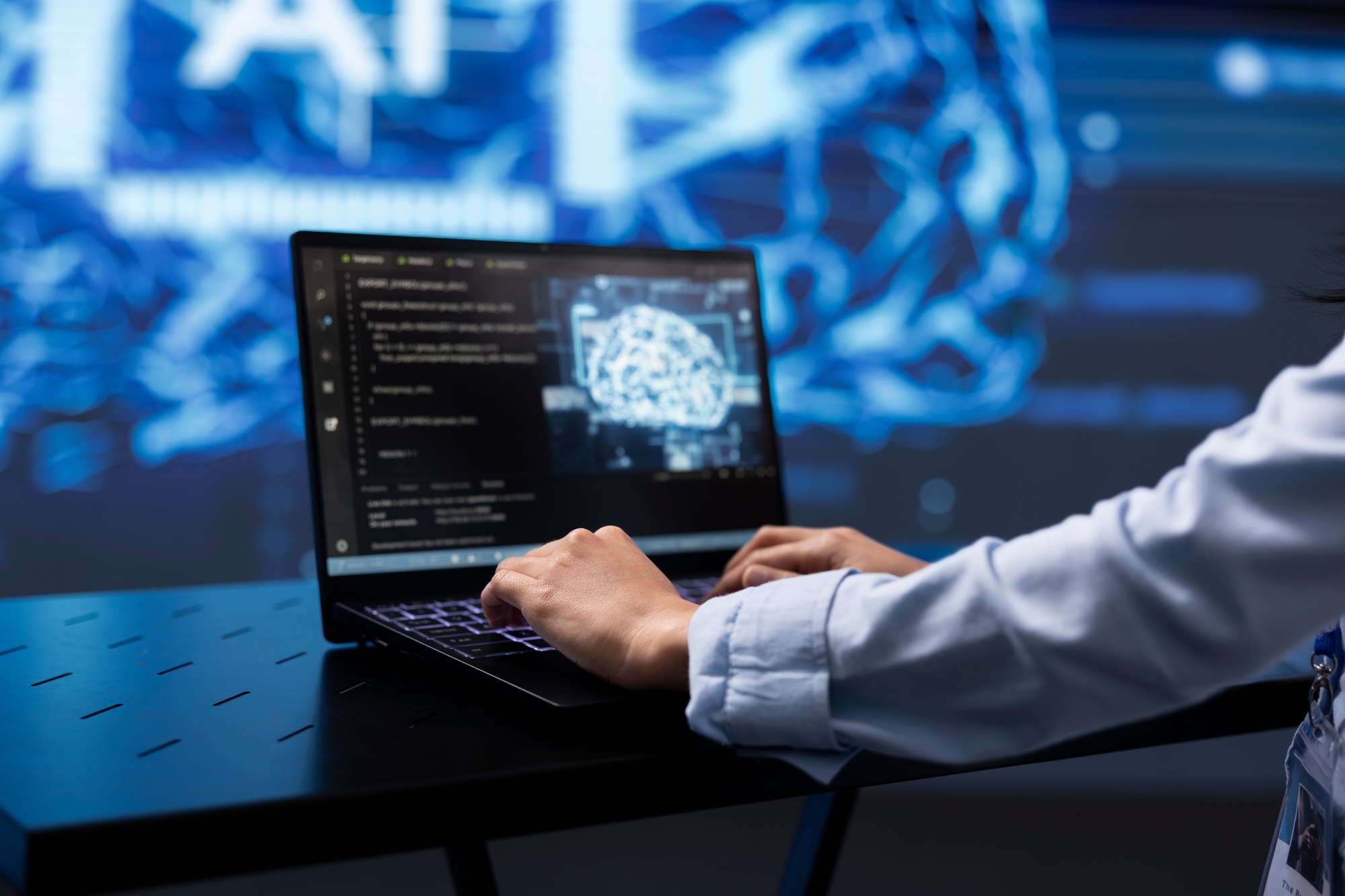 Close up of worker using artificial intelligence on notebook