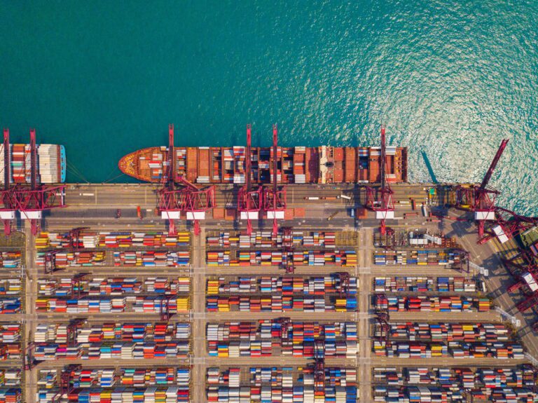 container cargo ship in the export and import business and logistics. Shipping to the harbor
