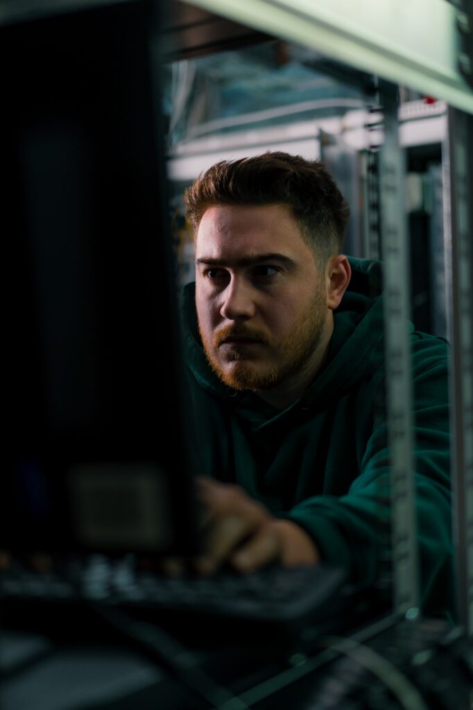 hacker in data center hacking software system vulnerable cyber security server room technology