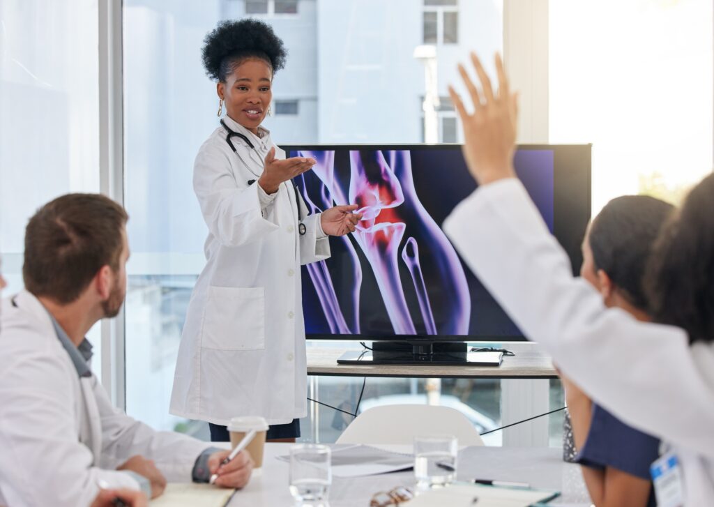 Medical presentation, black woman presenter and healthcare team question. X ray research, happy and