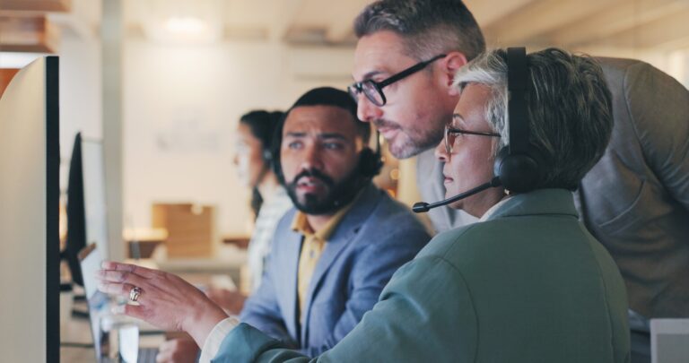 People, group and call center with computer, reading and teamwork for tech support in modern office