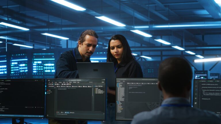 System administrators in server hub monitoring data center