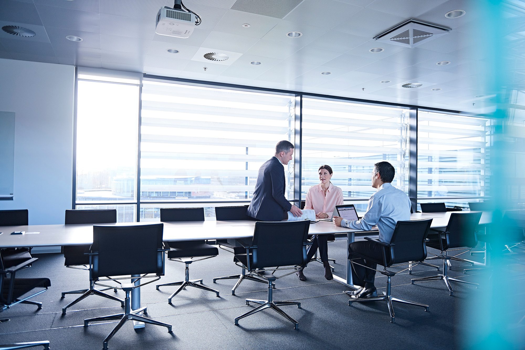 Business team meeting at boardroom table