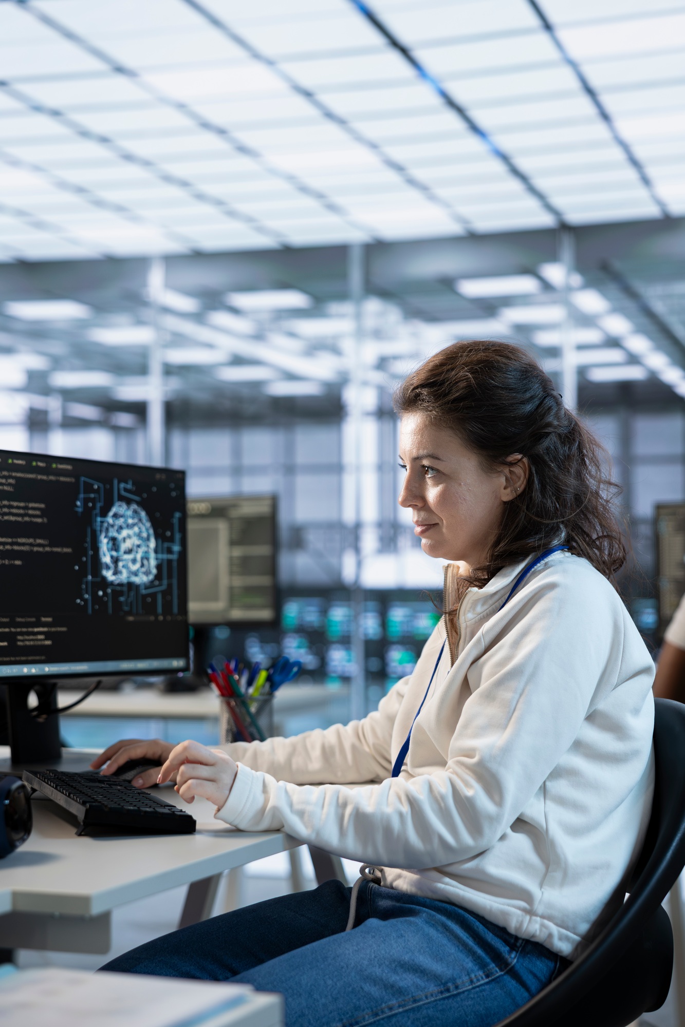 Woman trying to fix error in high tech AI data center workplace, solving tasks