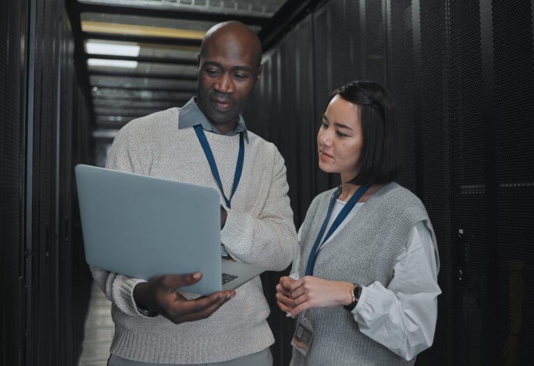 Coding, black man and woman with laptop, server room and cloud computing for data analytics, system.