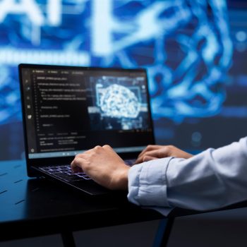 Close up of worker using artificial intelligence on notebook