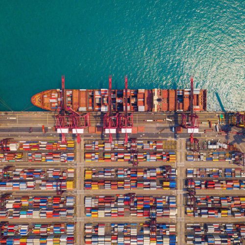container cargo ship in the export and import business and logistics. Shipping to the harbor